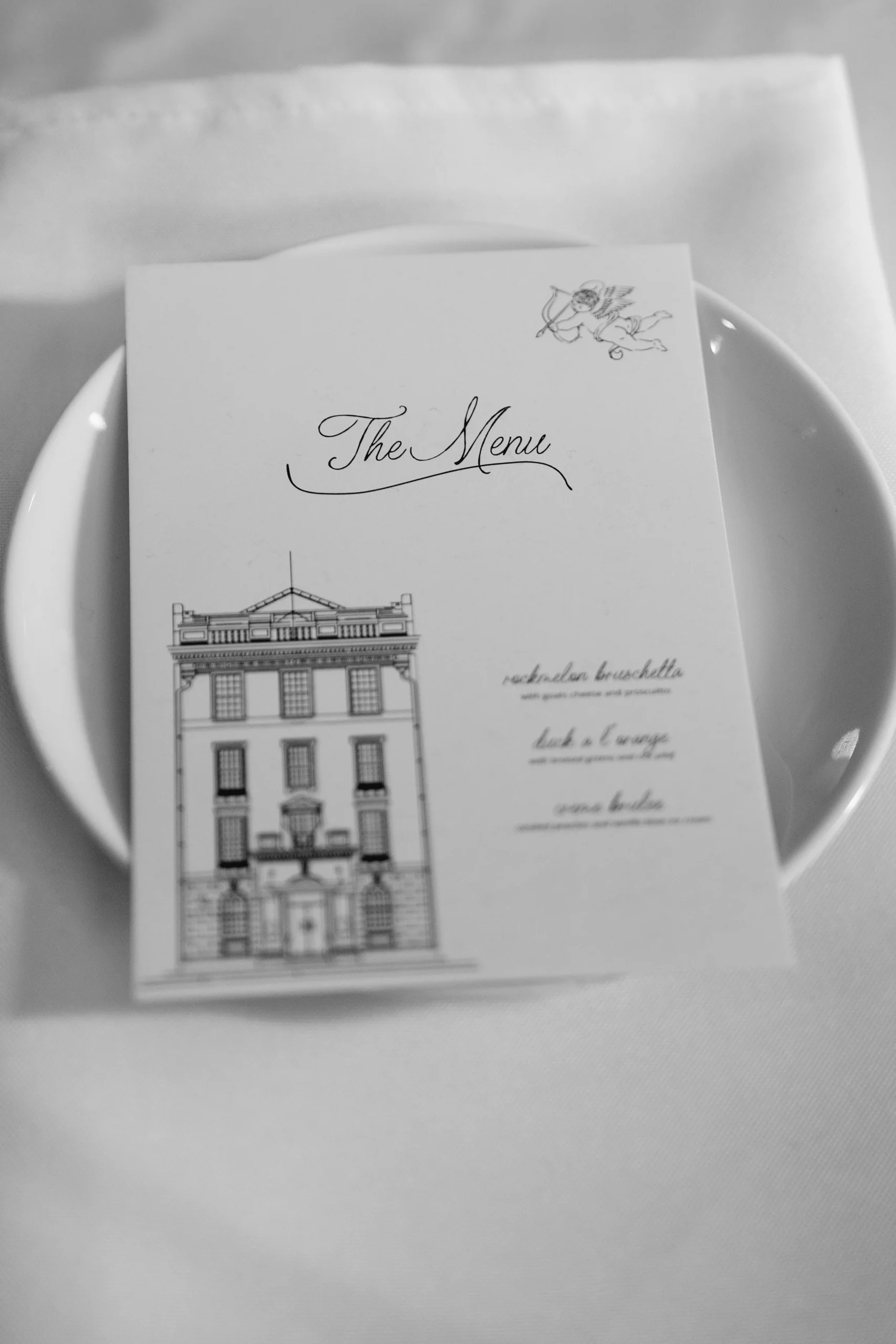 wedding menu with a sketch of a building