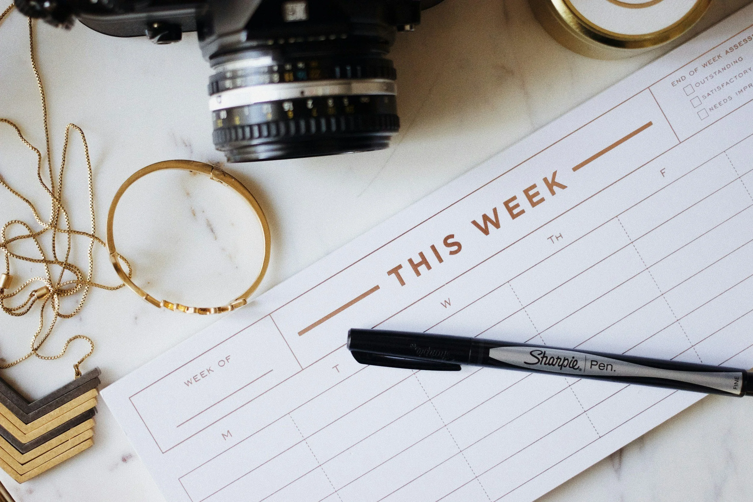 wedding planning calendar with a camera and pen