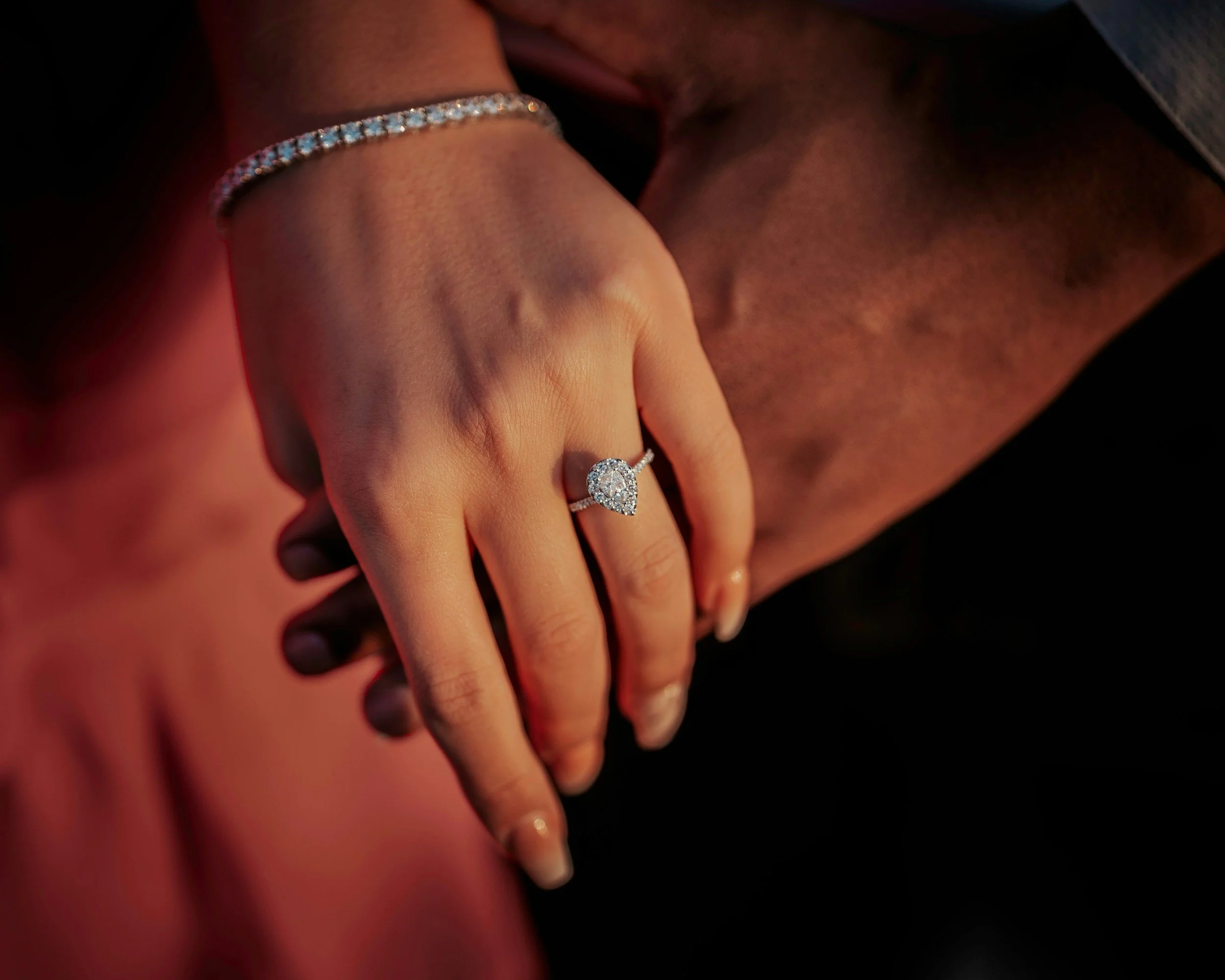 close up of engagement ring on a woman's hand