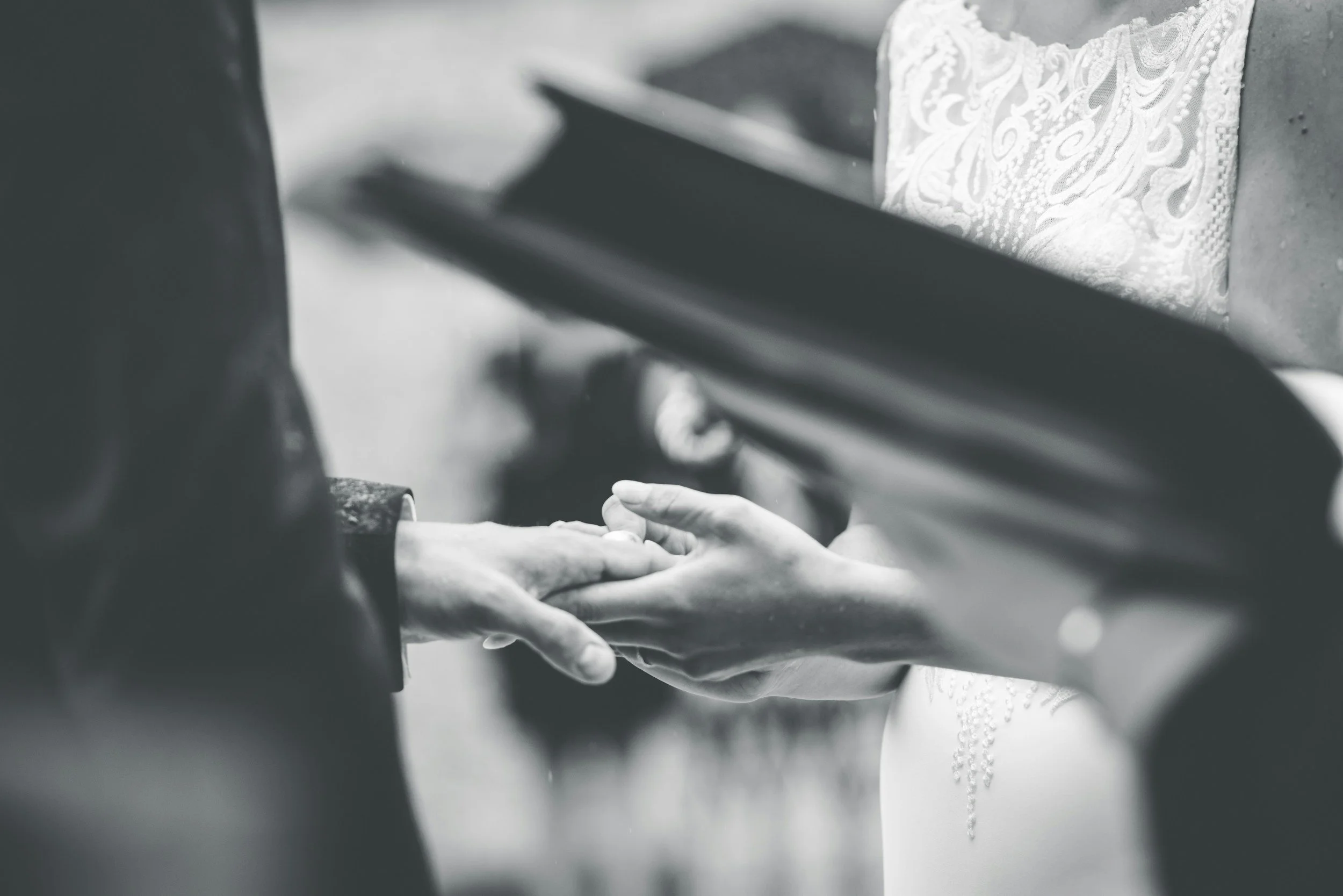 bride and groom close up of hands at the altar